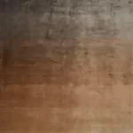 Градиентный ковер Sunset Taupe с переходом от тёмного к тёплому оранжевому.